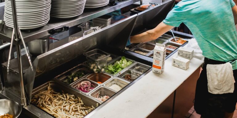 A wide lineup of Hoshizaki commercial kitchen equipment, including ice machines, a refrigerator, a prep table, and a backbar cooler